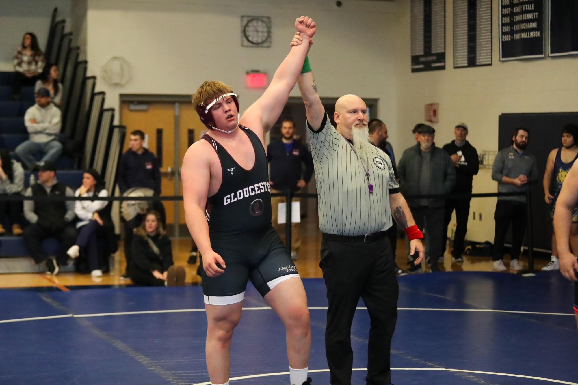 Senior Chris Laine celebrates after a pin at Sons of Italy Wrestling Tournament. 