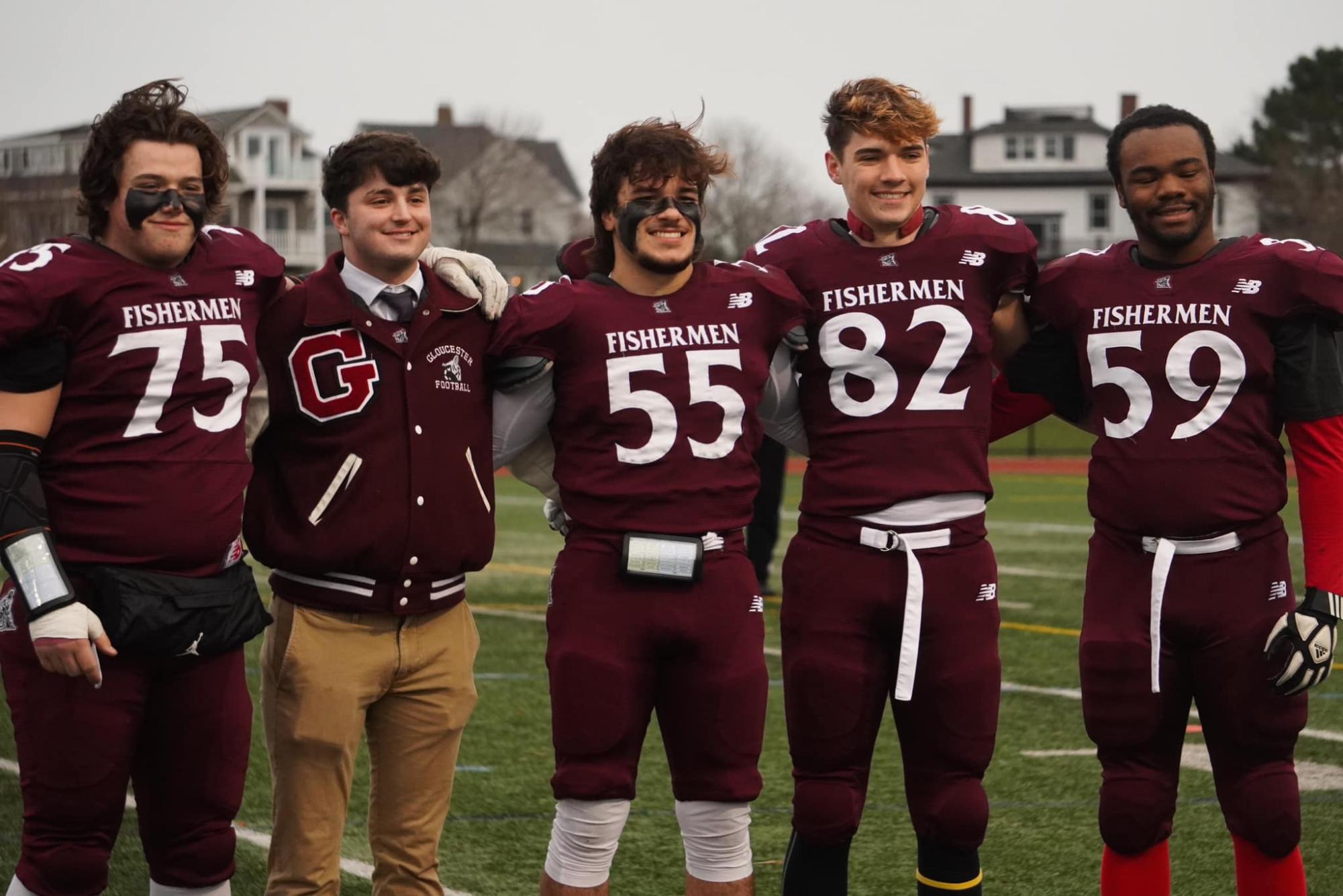 The GHS Football team's seniors pose on Thanksgiving in the pre-game senior day ceremony.