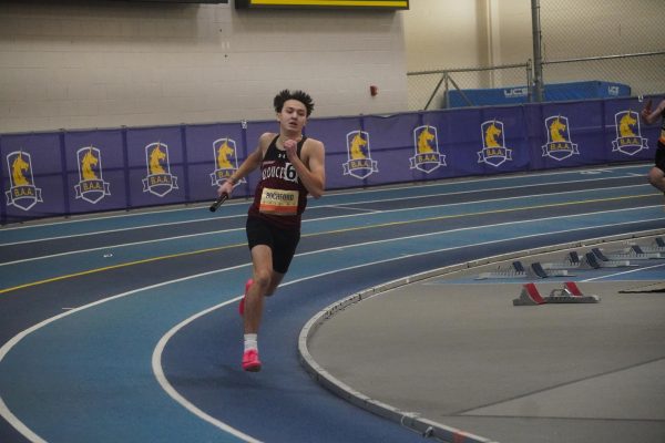 Dylan Rochford finishes his leg of the mixed 4x400 relay last weekend at the Northeast Invitational.