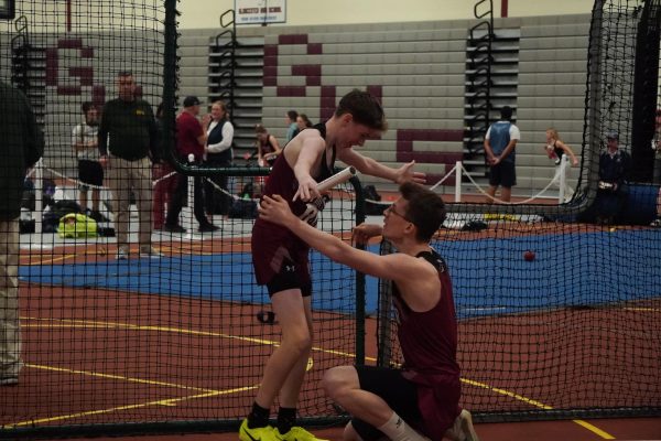 Brendan Smith (Left) and Gabe Pate (Right) hug after their 1st place finish in the 4x400 men's relay.