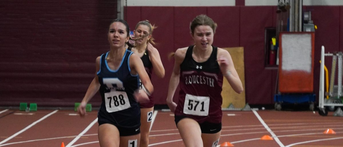 Grace Castellucci and Avery Marcus push each other at the finish line on the 300 meter finals.