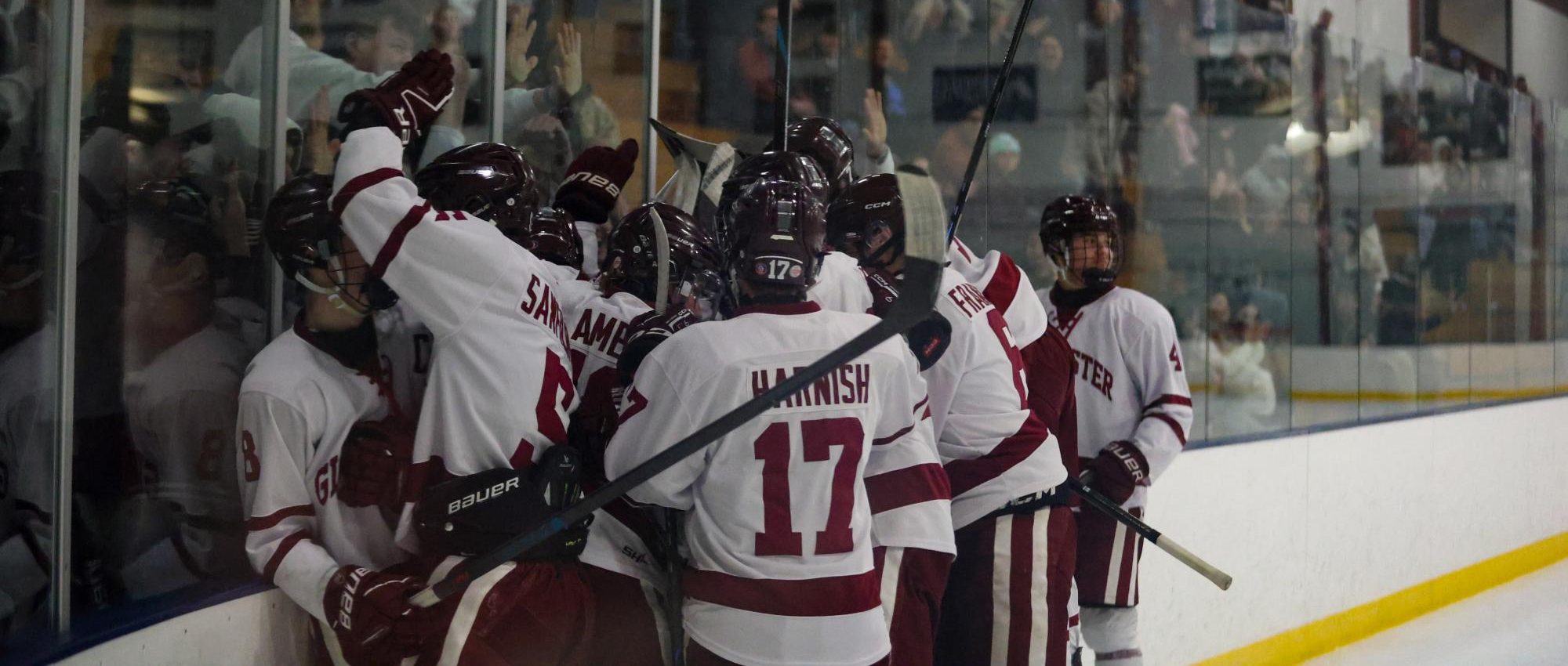 The hockey team celebrates after one of their many comeback wins this season.