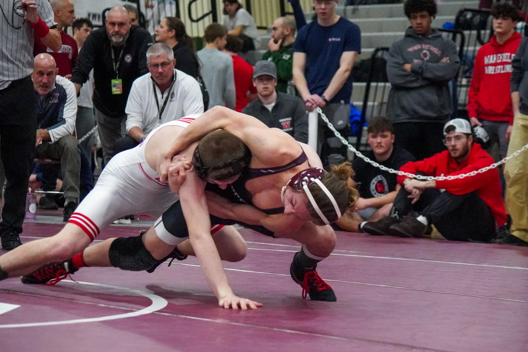 Gloucester's Jayden Chadwick takes down his Wakefield opponent.