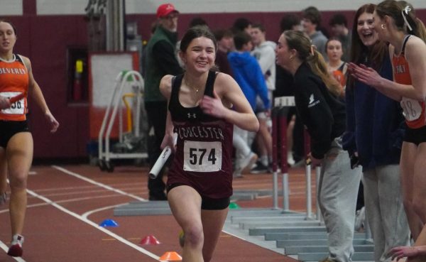 Skye Ciolino takes the turn in the 4x400 relay during the Gloucester girls' team win against Swampscott.