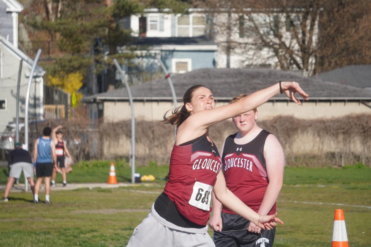Meg Hurd tosses the shot put during the girls' section of the NEC Spring Challenge.