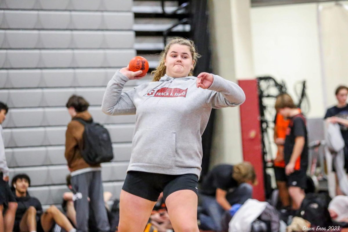 Lauren begins to throw the shotput. Lauren began to get college interest early in her high school career.
Photo used with permission of Dawn Enos 