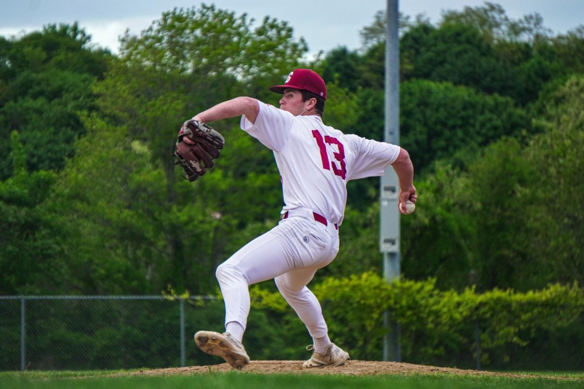 Brayden Francis winds up for a pitch during a game this spring. He finished his high school career as one of the best pitchers on the North Shore.