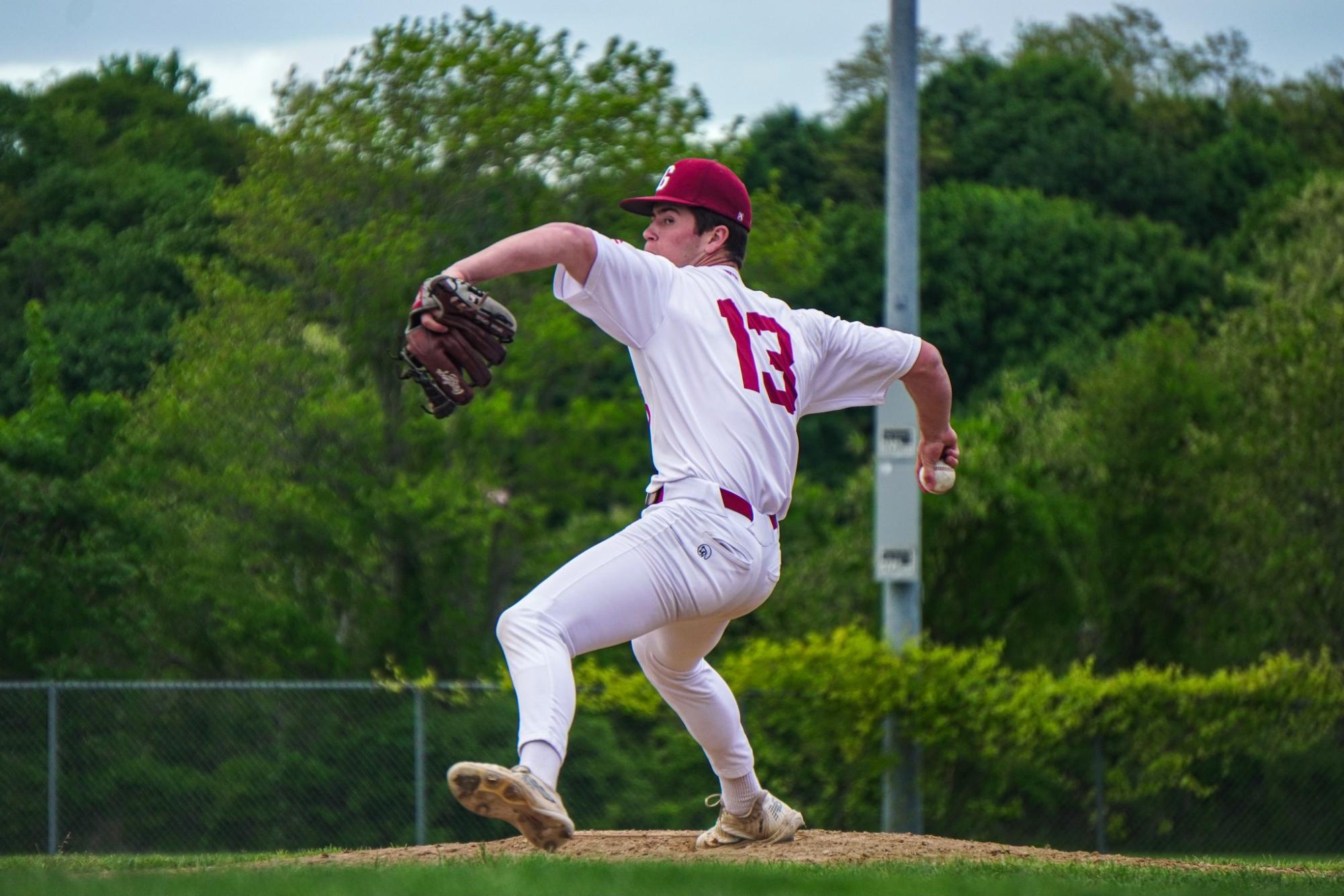 Brayden Francis winds up for a pitch during a game this spring. He finished his high school career as one of the best pitchers on the North Shore.