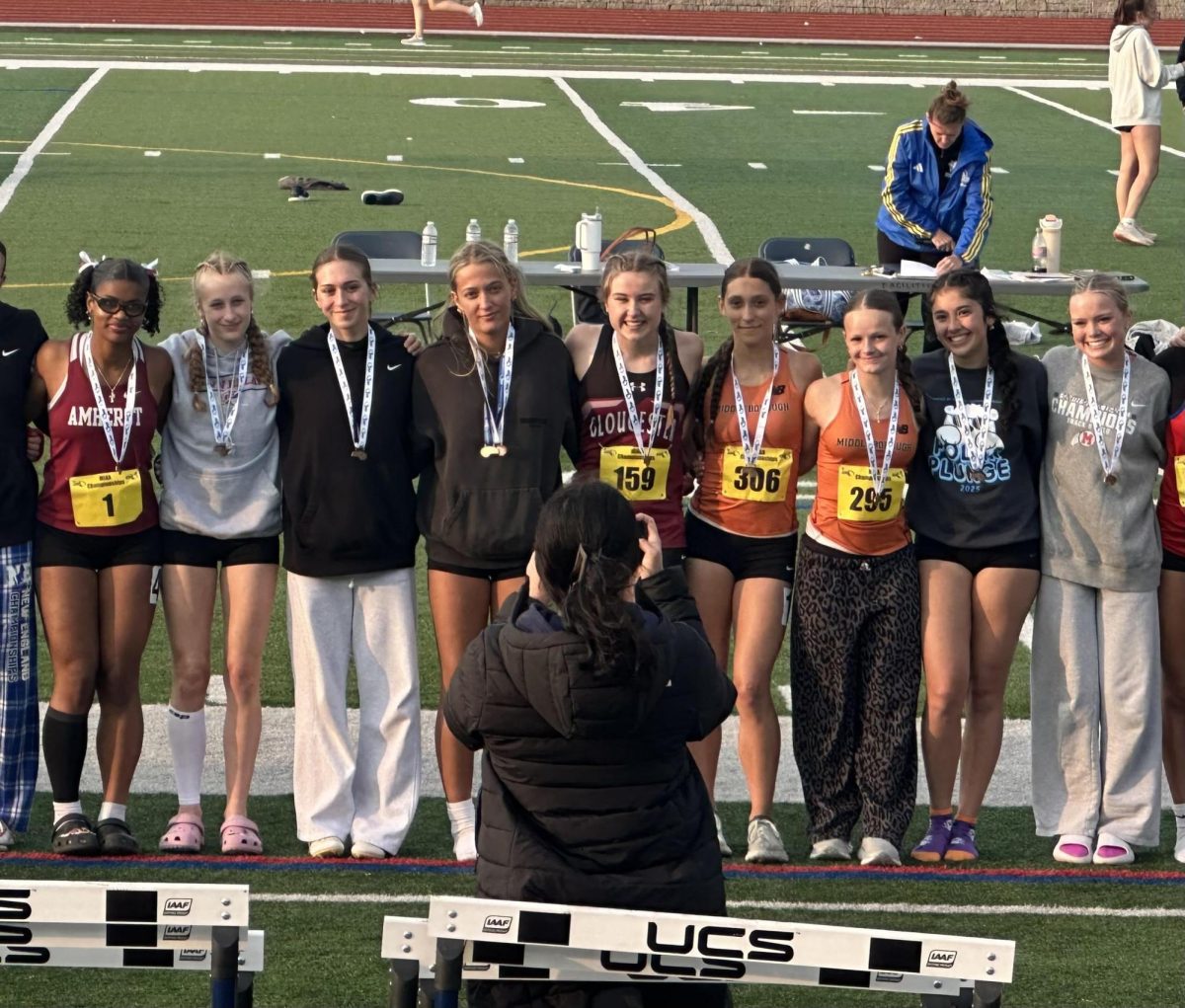 Aili Spencer and Grace Gastellucci pose with their medals after breaking the school record in the 4 X 100 relay at D4 states last weekend. 