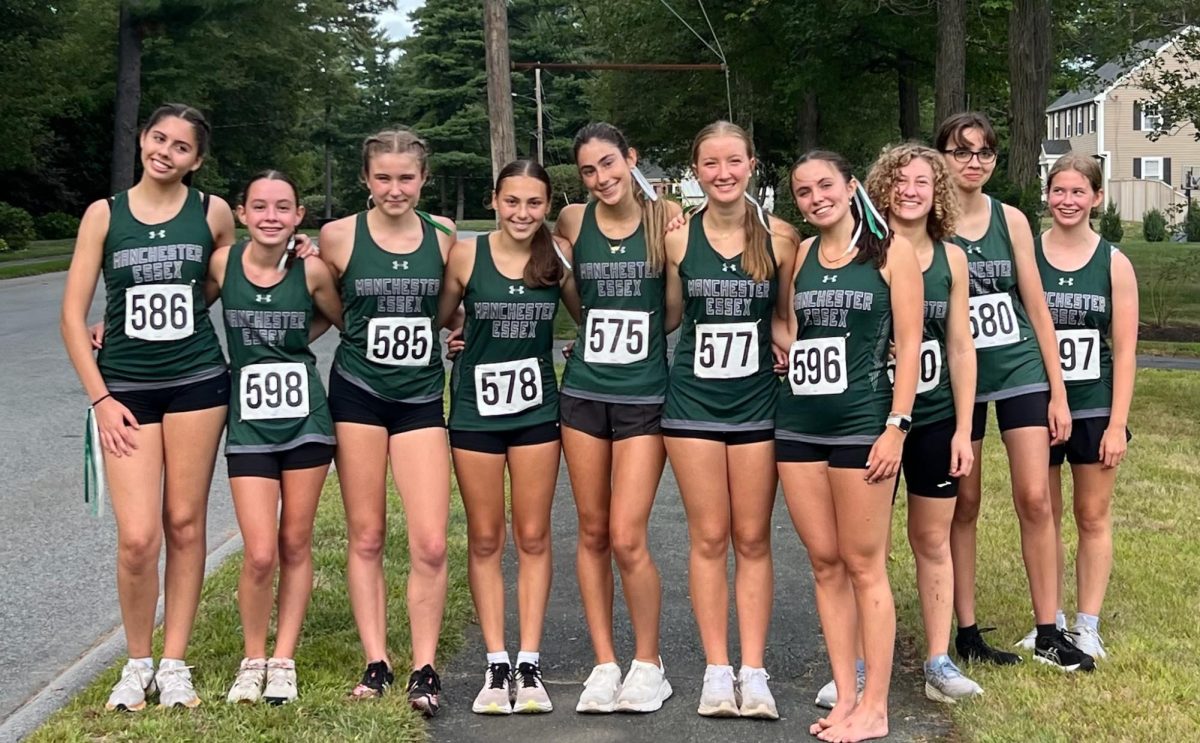 The Cross Country team poses together before their race. [Photo courtesy of Megan Sergi]