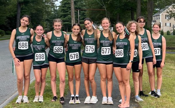 The Cross Country team poses together before their race. [Photo courtesy of Megan Sergi]