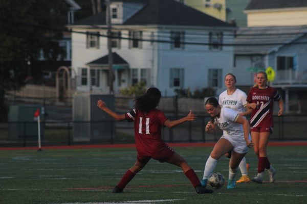Jude Friday kicks the ball downfield.