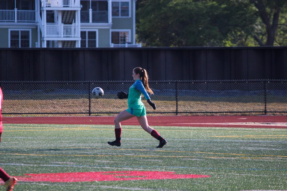 GK Jessica Harvey punts the ball across the field. [Photo courtesy of Lauren Sargent]