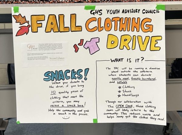 The Youth Advisory Council clothing drive stand outside of the Cafeteria