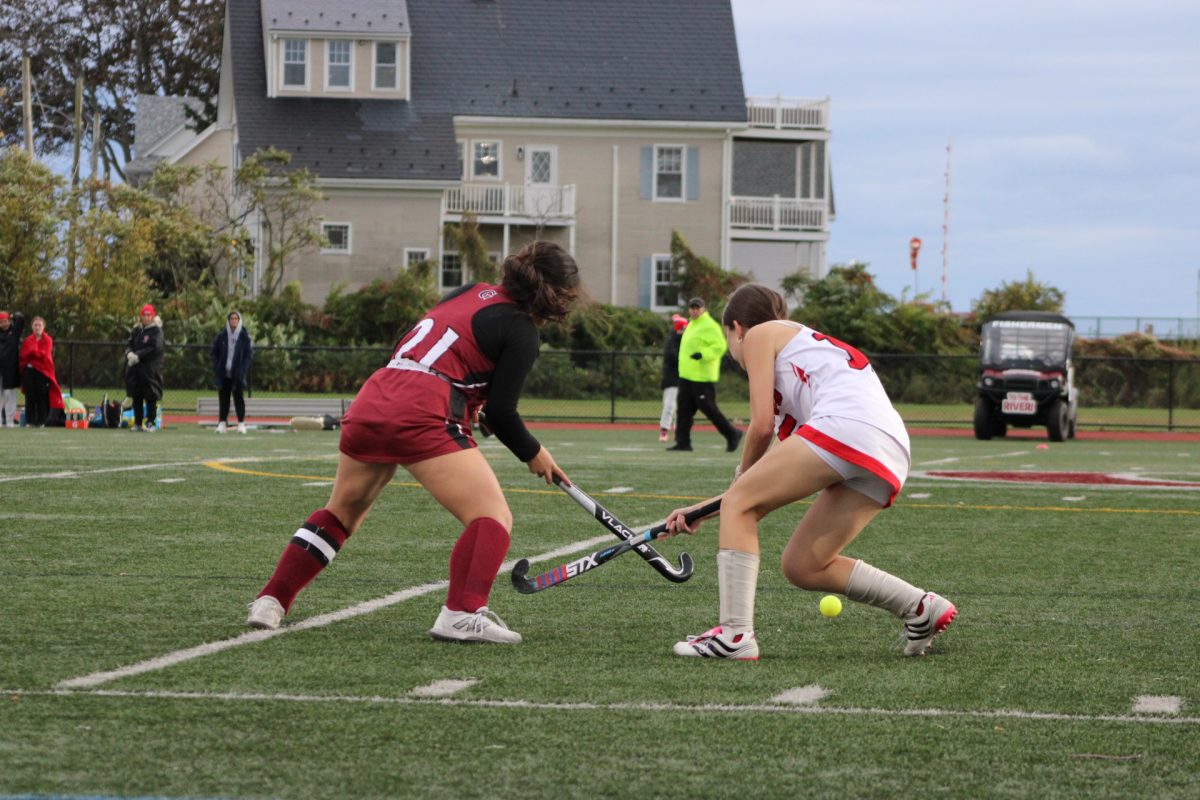 Ashlyn Orlando battles a Sachem for possession.