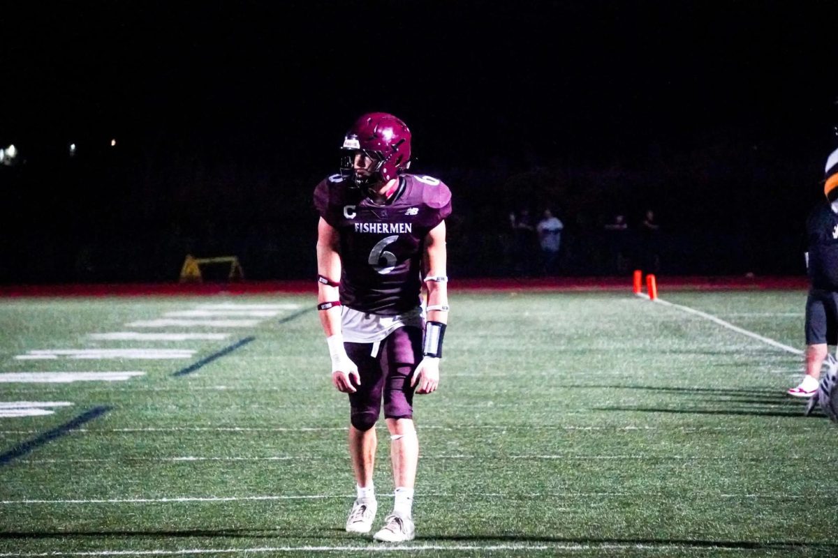 Jaylen Severino prepares for a run in a game earlier this season. The senior captain was awarded the Boston Globe and Boston Herald Player of the Week for his performance against Salem. 