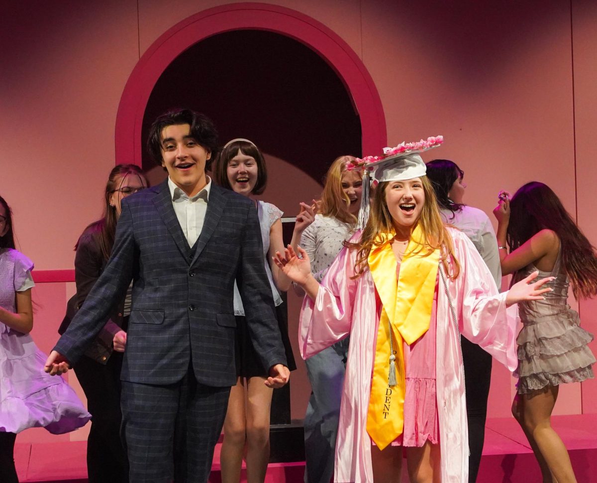 Junior Nathan Gorman-Melo and freshman Liliana DiMercurio belt out during the show's closing number.
