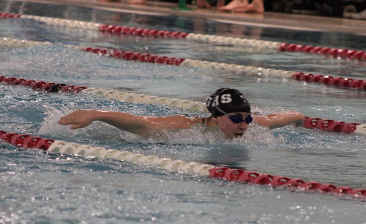 Susie Low competes in the butterfly. 