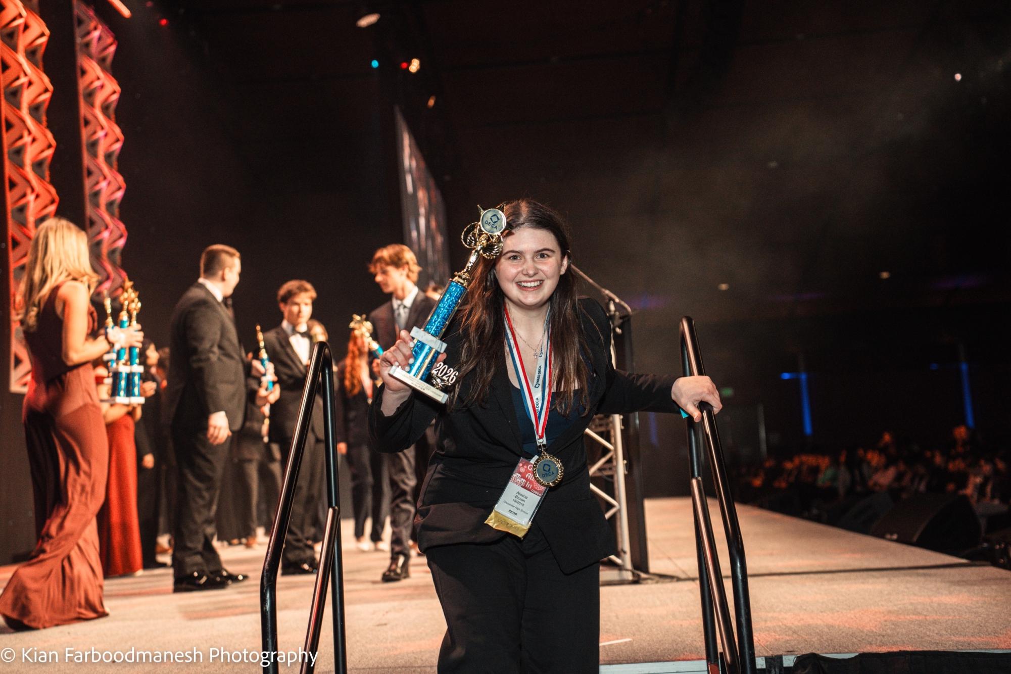Aleena Brown celebrates coming off the stage during the Grand Awards Ceremony at DECA SCDC. [Photo courtesy of kianfpics on Instagram]