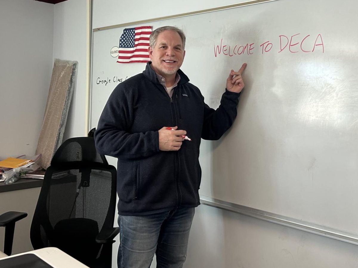 New Info-tech and Marketing teacher Brady Frost welcomes people to the DECA Club. 