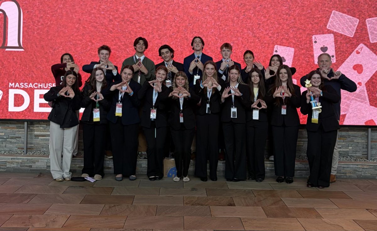The Gloucester DECA chapter poses together after the Grand Award Ceremony. [Photo courtesy of Gloucester DECA]
