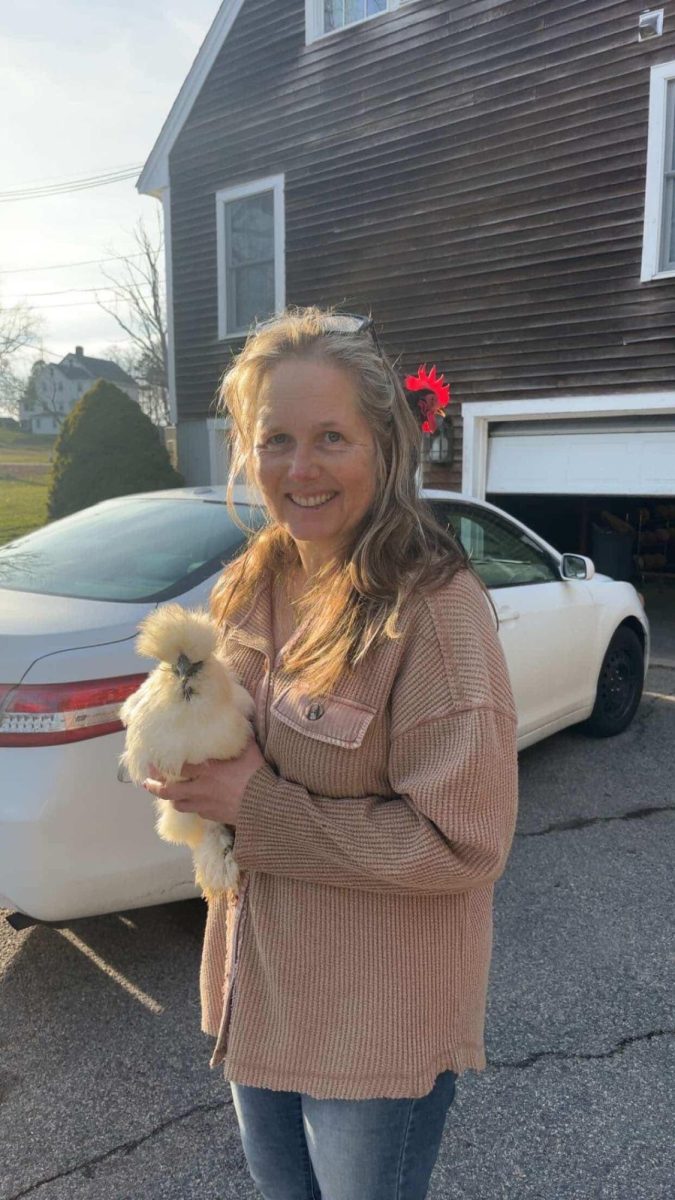 Ms. Lichtenwald holding one of her many chickens.