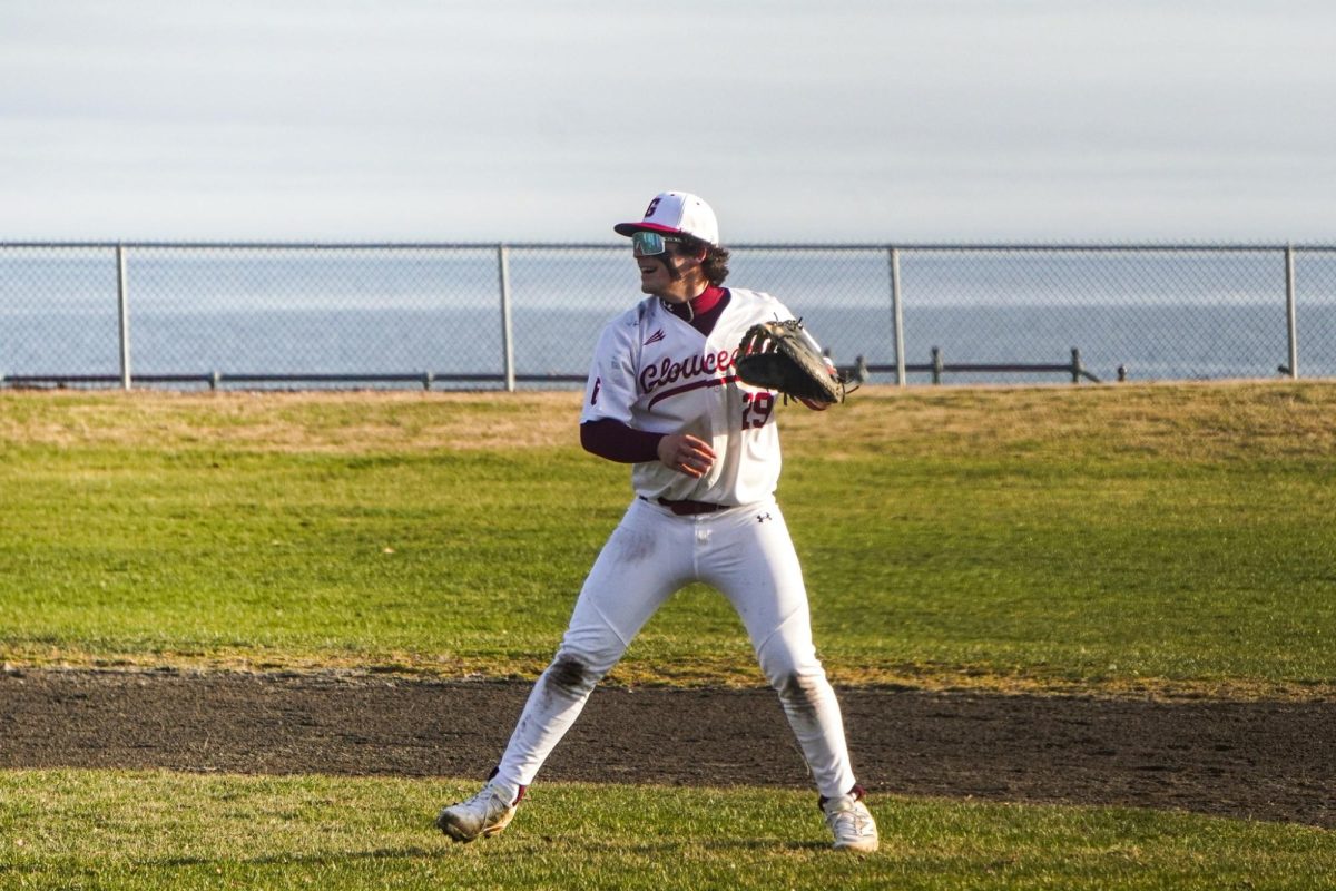 Nico Alves celebrates an out at first base in Gloucester's game against Salem.