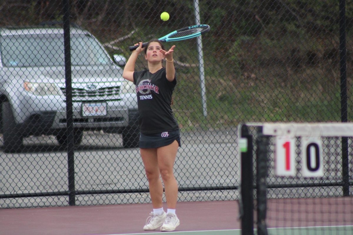 Senior Sabina Sapia serves the ball while playing second doubles.