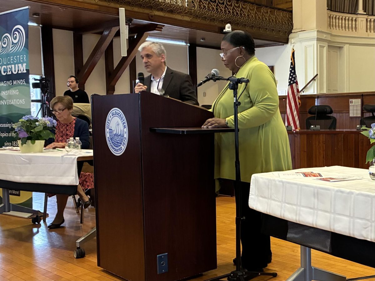 Guest speakers Harvard Professor Steven Levitski, and political commentator Callie Crosley speak at the Gloucester Lyceum event at City Hall. 